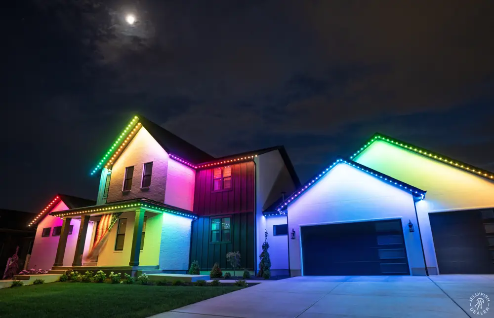 Two-story home with rainbow roofline lighting